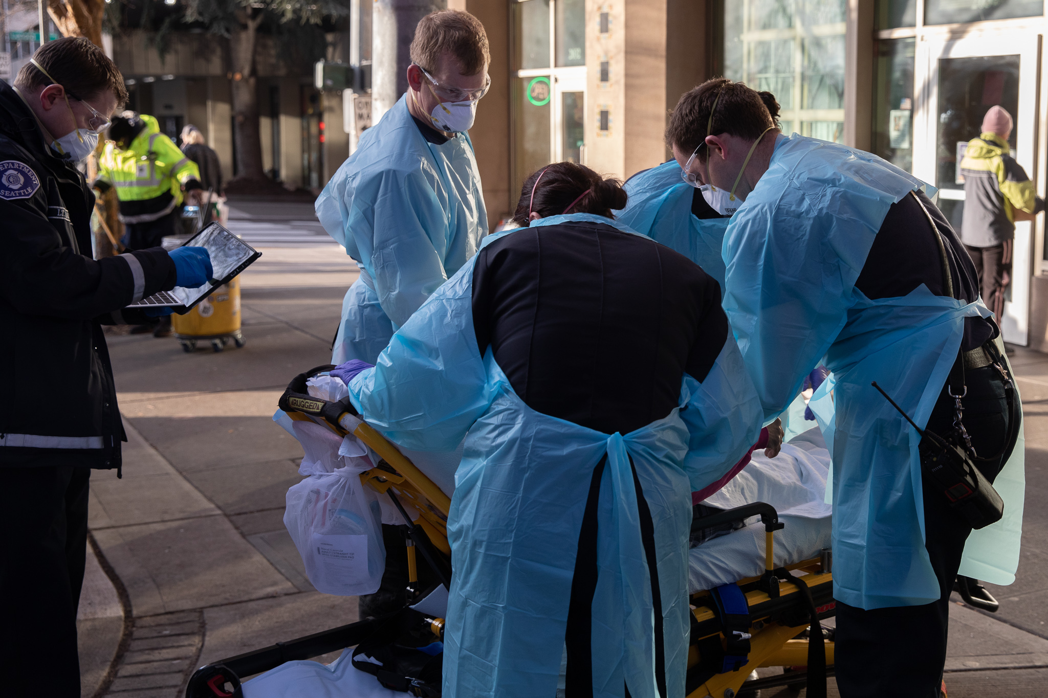 medical personal respond to an emergency call downtown