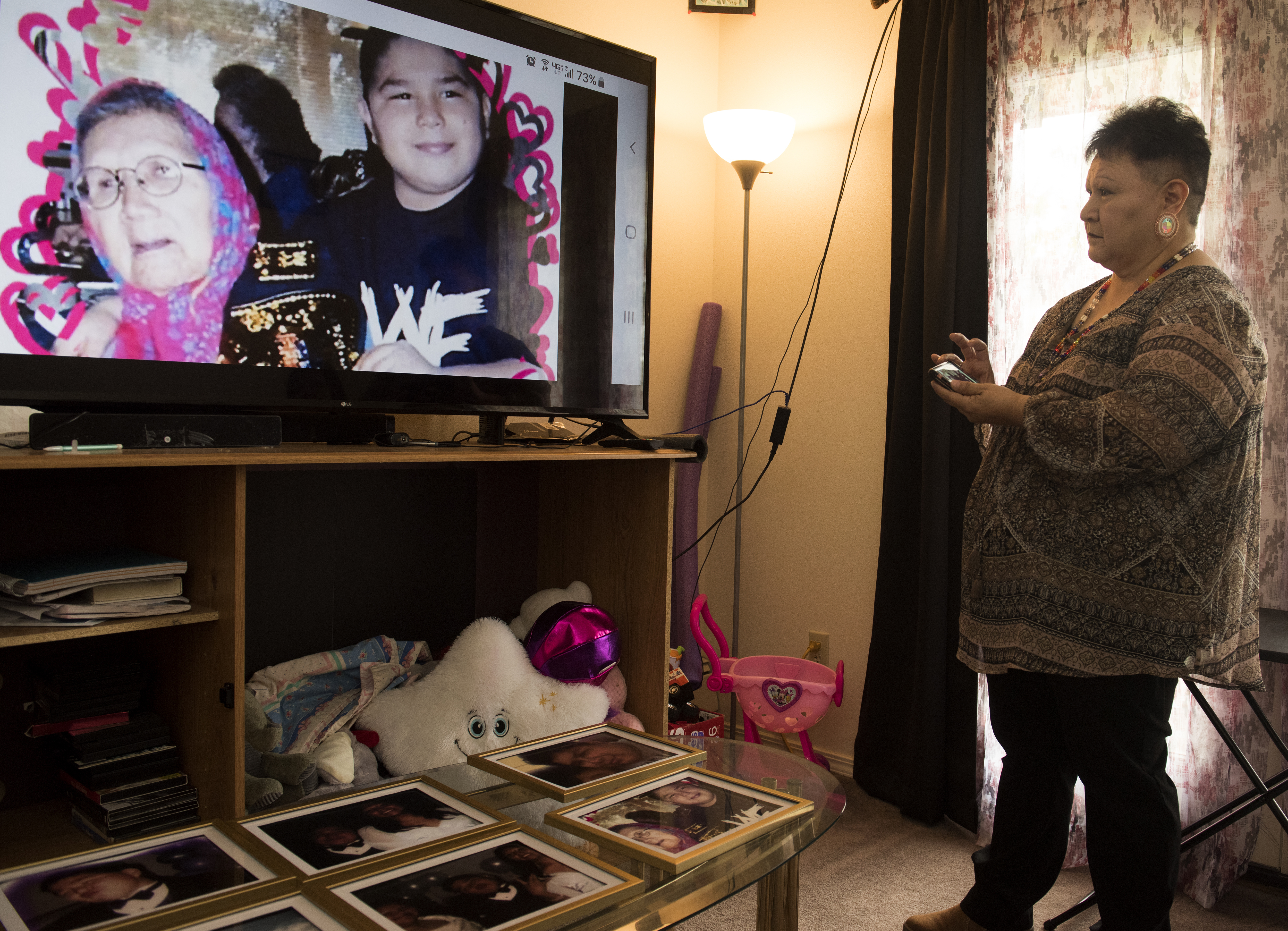 Willeena George with pictures of her son Domonique Nappo