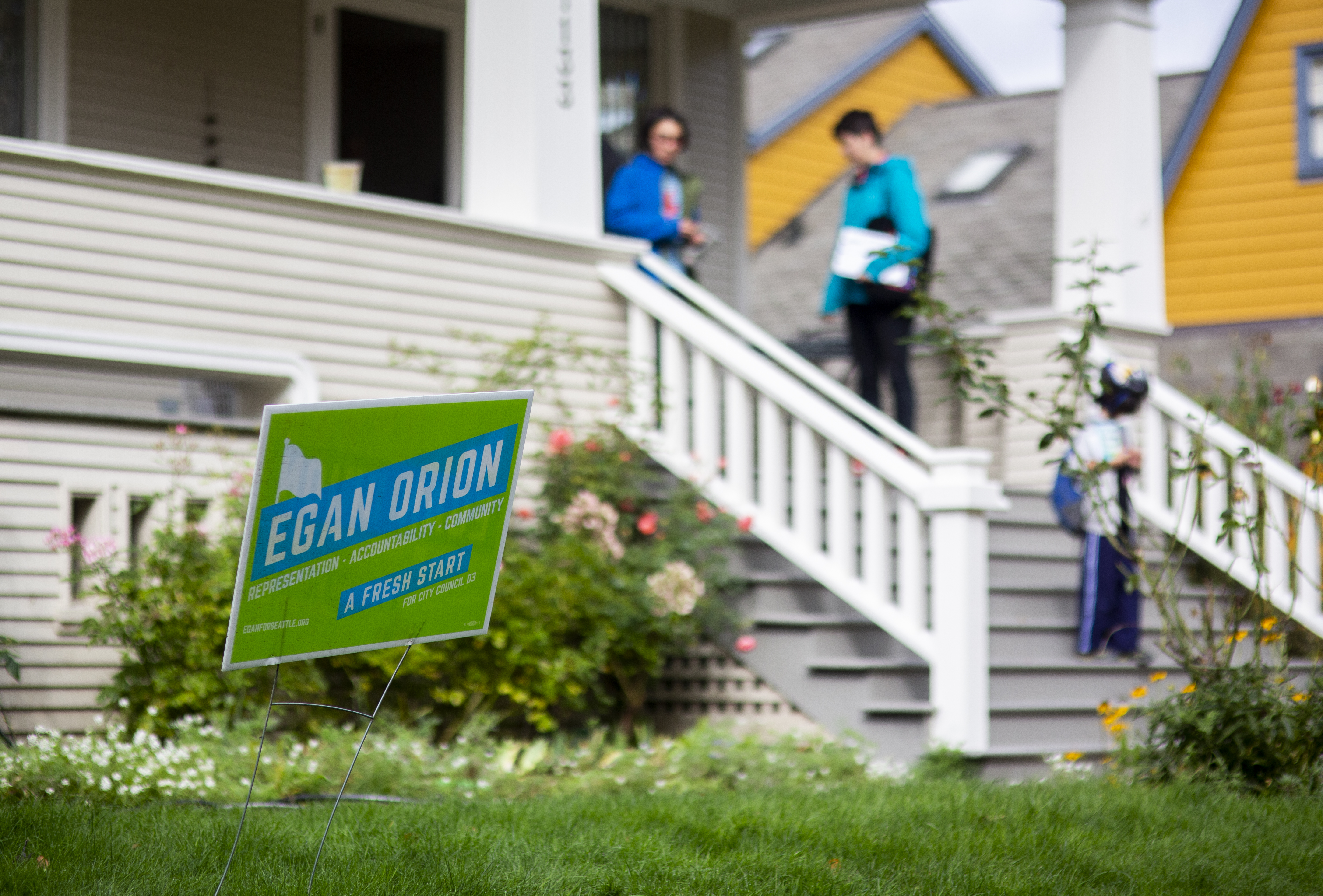 Campaign signs on a lawn.