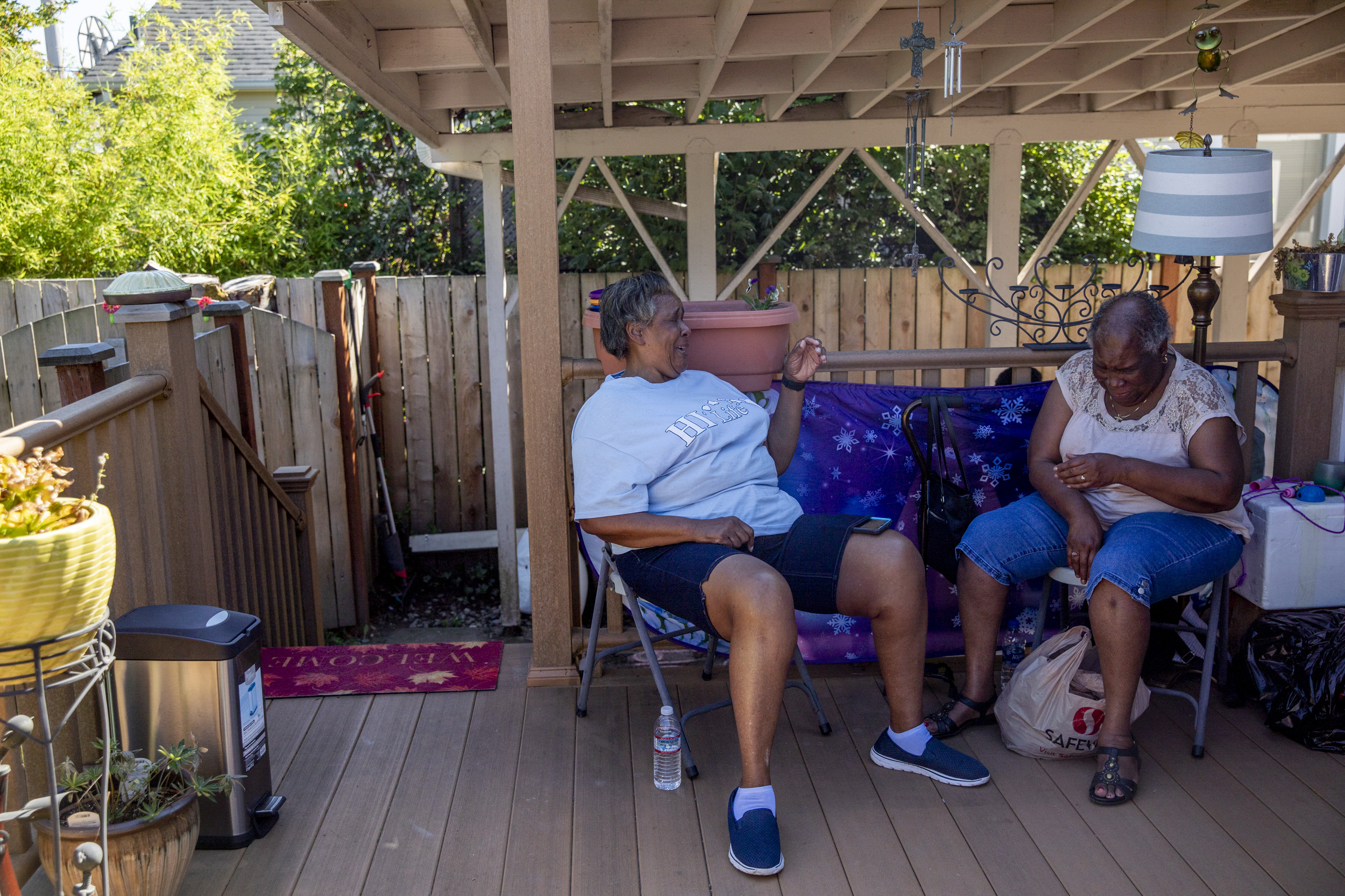 Wendy and Gloria sit together on the porch