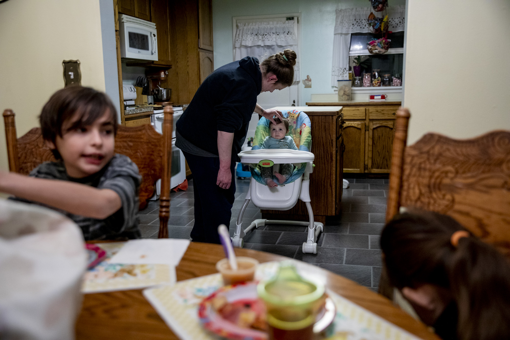 Becca feeds her daughter