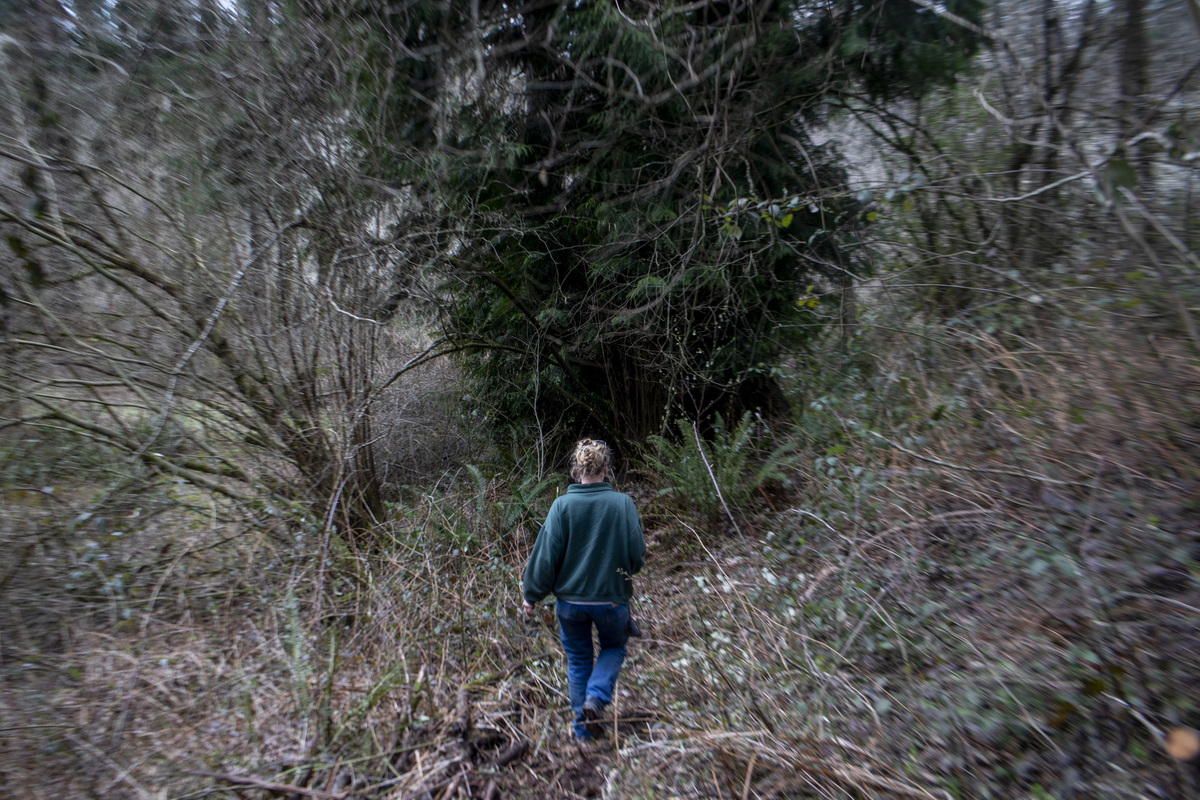 A woman walking in the woods