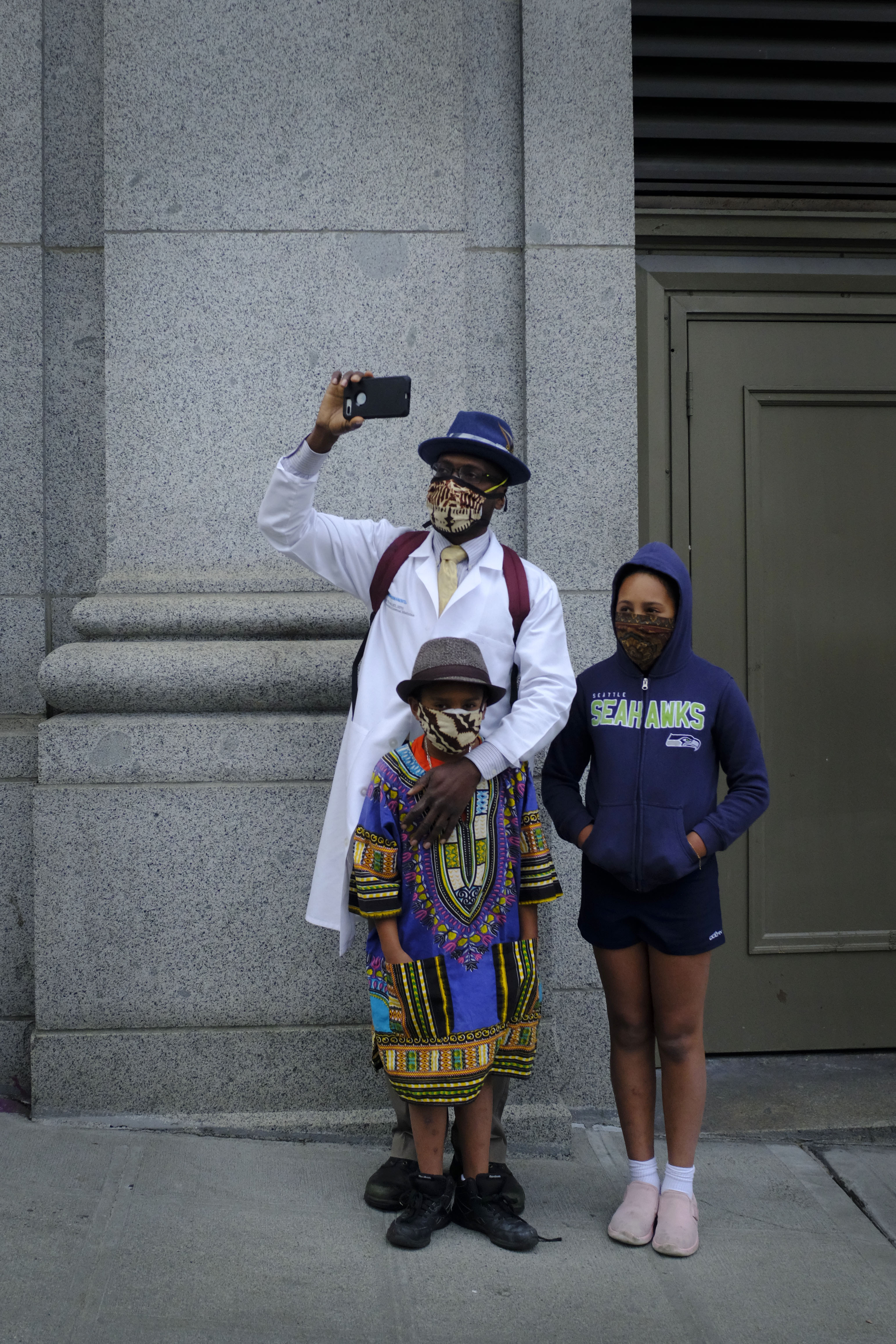 man and children standing