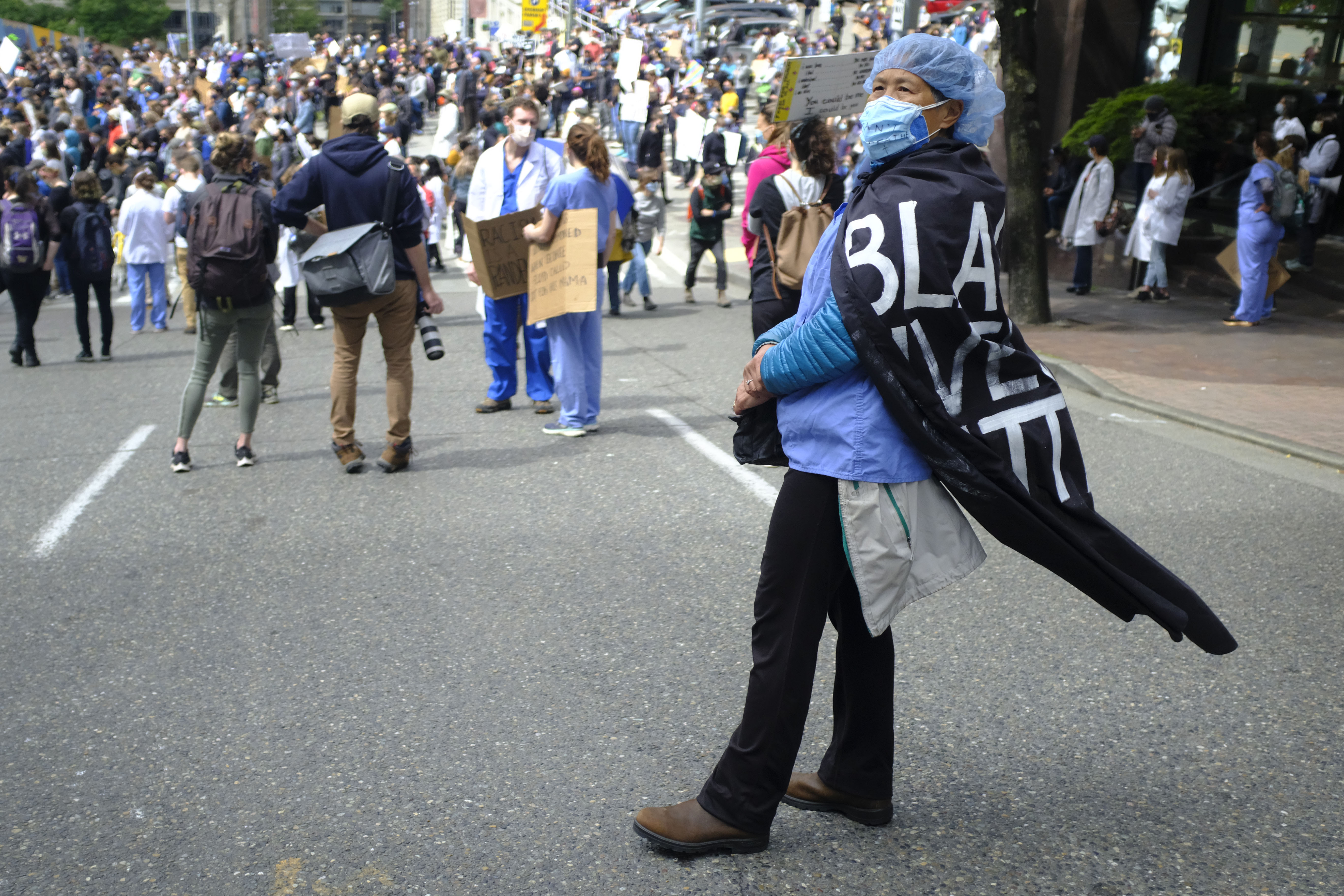 woman with black lives matter cape