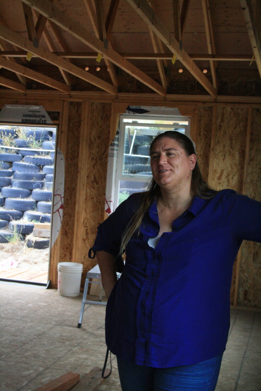 Woman standing in a structure