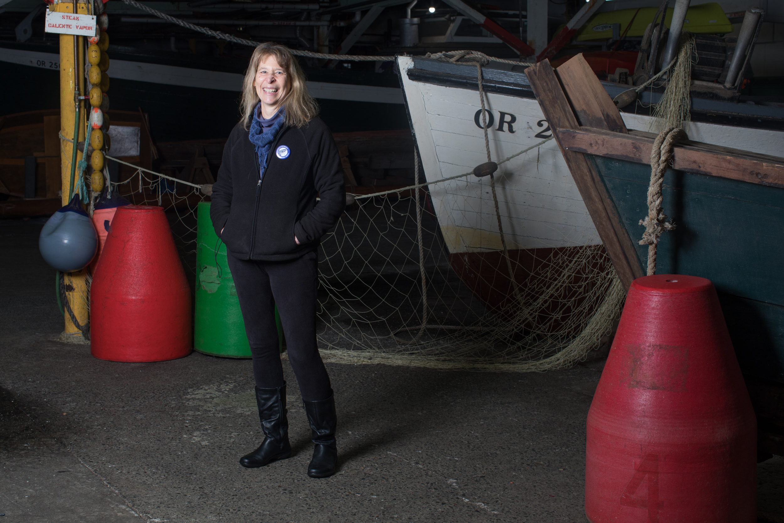 Holly Hughes of Indianola, Washington stands for a portrait inside the cannery building on historic Pier 39 in Astoria. 