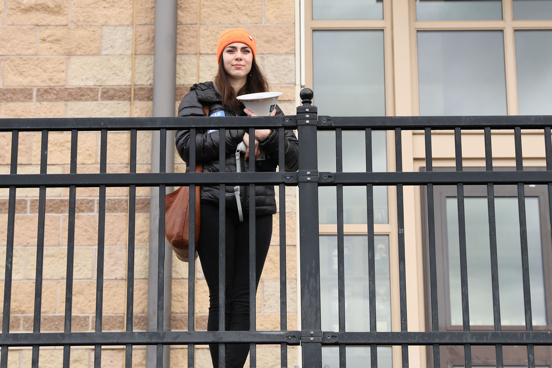 Organizer and Roosevelt High School junior Scout Smissen stands above the school's football field during a student walkout protesting gun violence in Seattle, Mar. 14, 2018. (Photo by Matt M. McKnight/Crosscut)