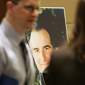 Prosecutor Thomas C. Wales is seen between his son Tom Wales, left and daughter Amy Wales as they talk after a ceremony in a courtroom at the Federal Courthouse in Seattle in October 2006, held to observe the fifth anniversary of his slaying. (AP Photo/John Froschauer)