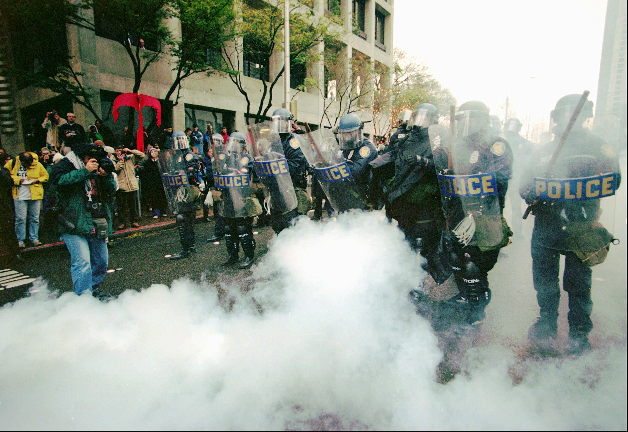 Seattle police clear an intersection of World Trade Organization protesters