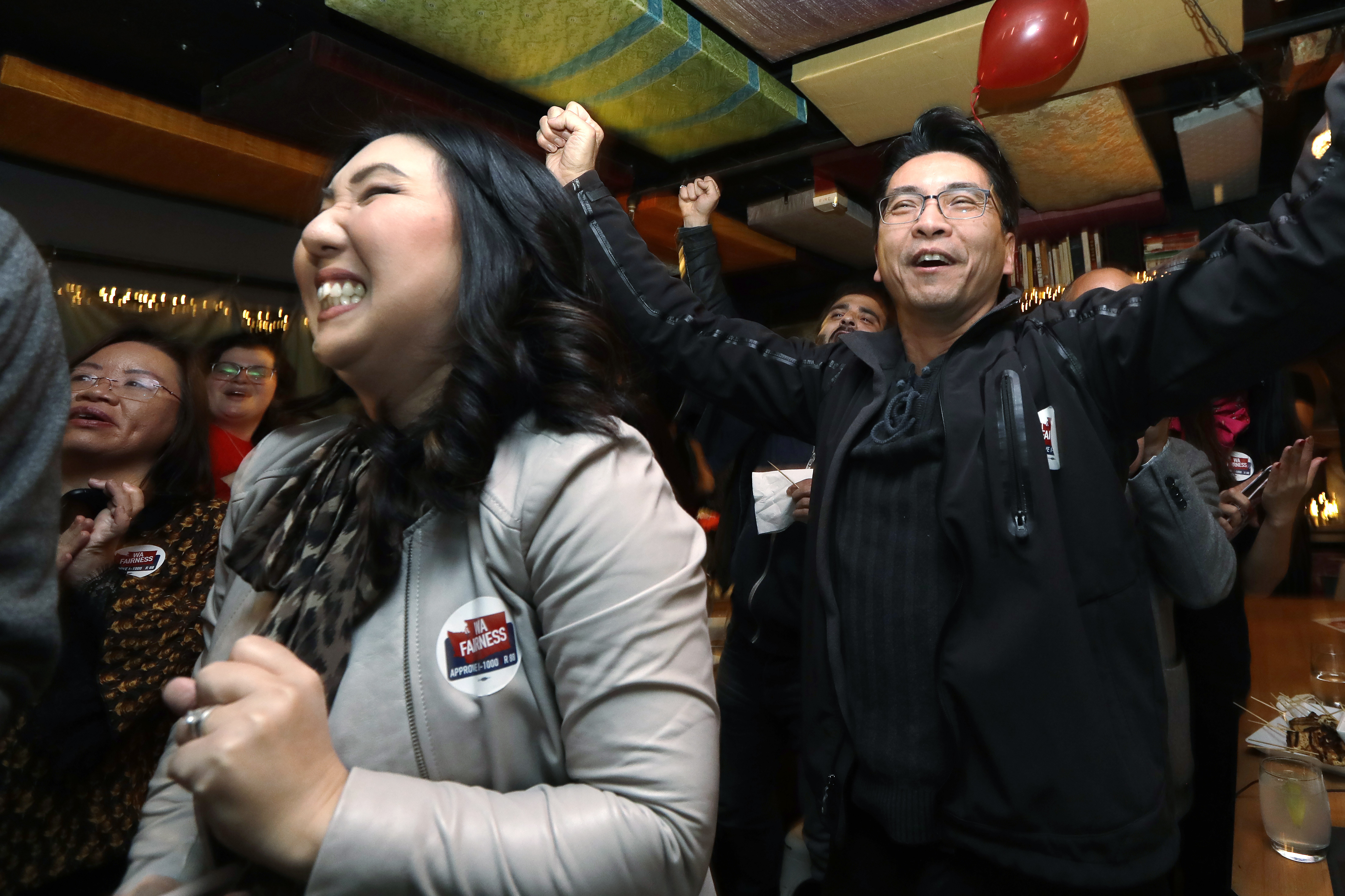 Supporters of Referendum 88 react positively to early returns.