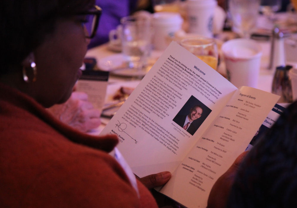 An attendee views the program