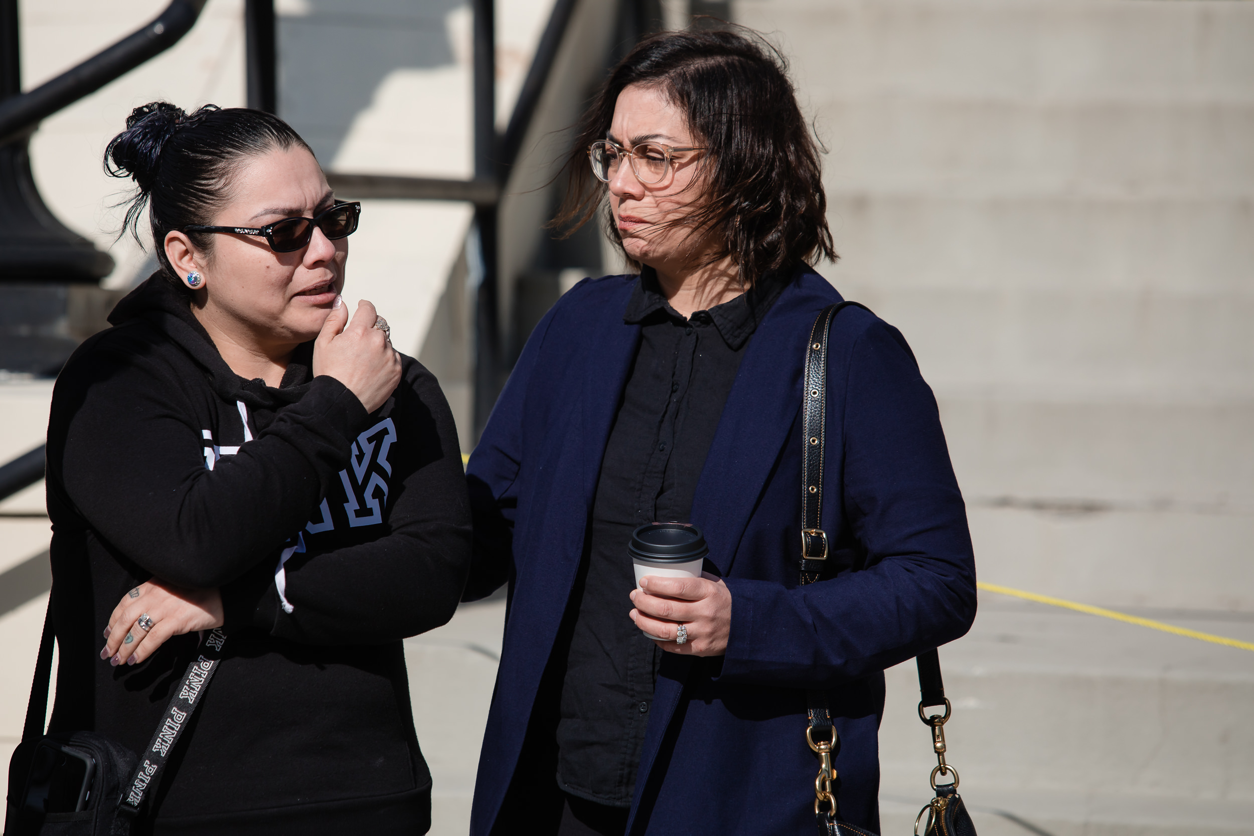 Abigail Scholar, right, executive director of Central Washington Justice For Our Neighbors, listens to Vanessa Lopez retell the story.