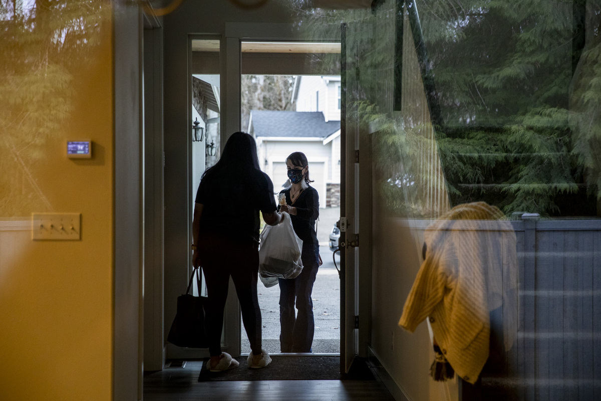 Woman opening door