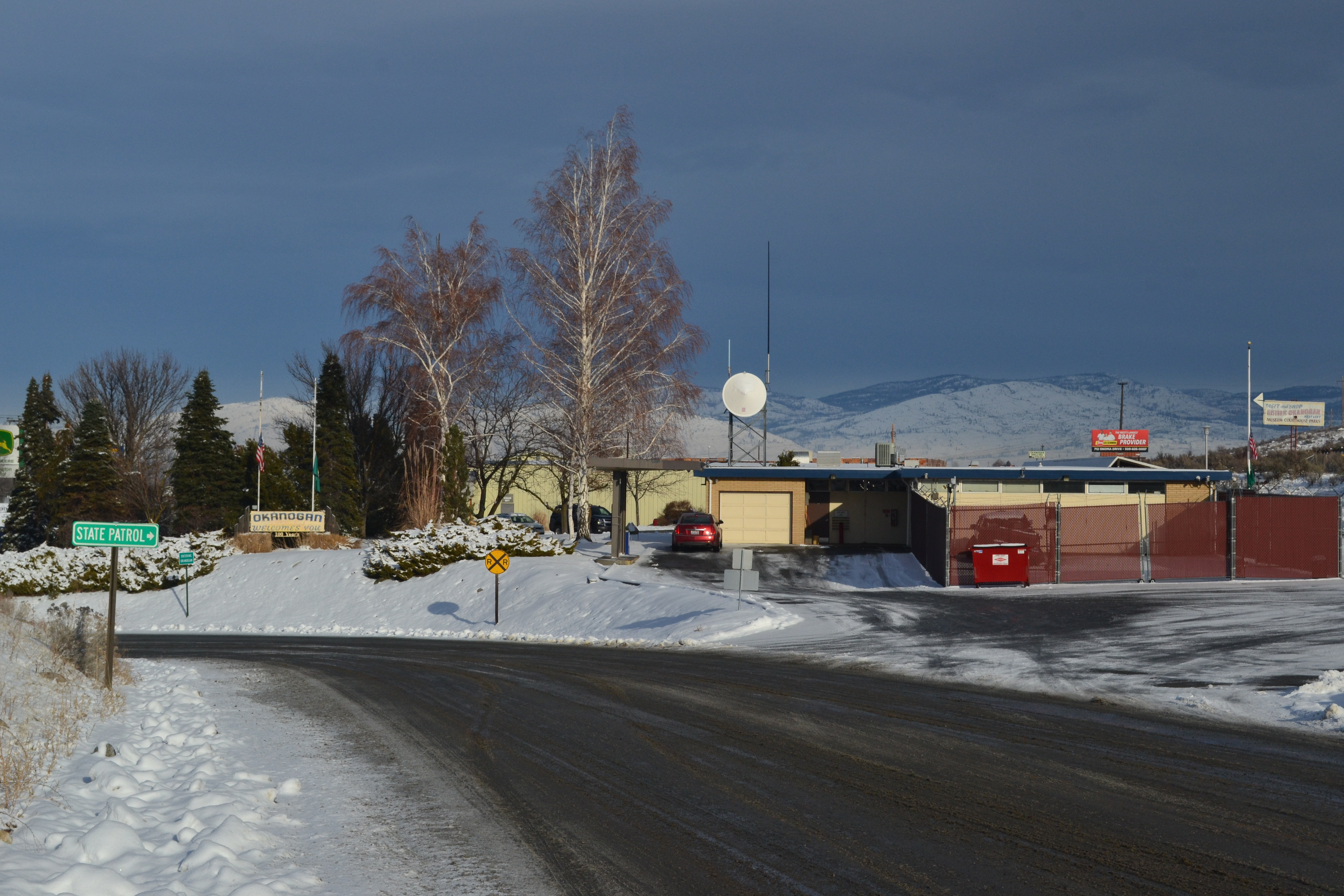 A group of buildings along a snowy road