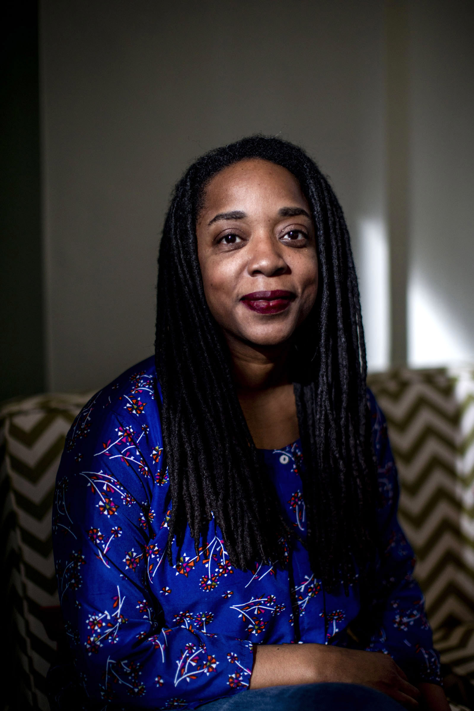 Tarika Powell at Sightline Institute in Seattle on Monday, Feb. 25, 2019. Powell is a researcher focusing on fossil fuel infrastructure development and her work in the Pacific Northwest informs policymakers and activists. (Photo by Dorothy Edwards/Crosscut)