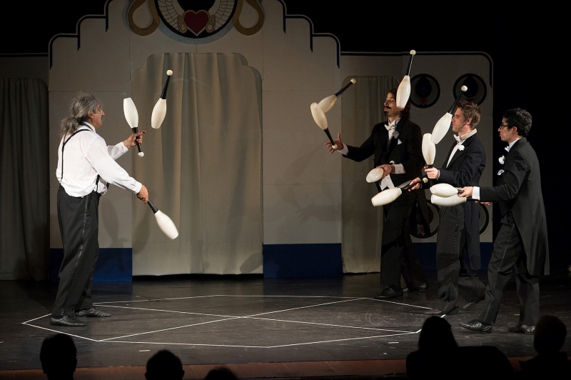 Flying Karamazov Brothers juggling pins