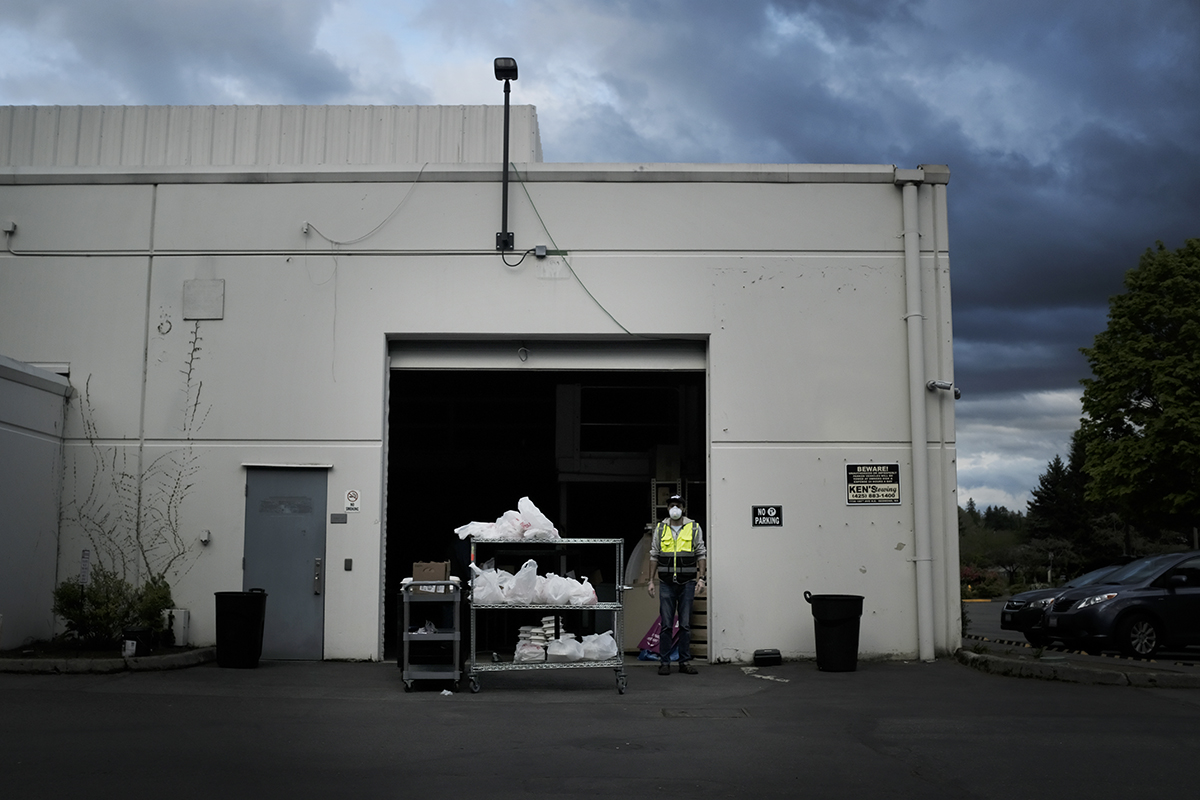 a man standing in front of bags