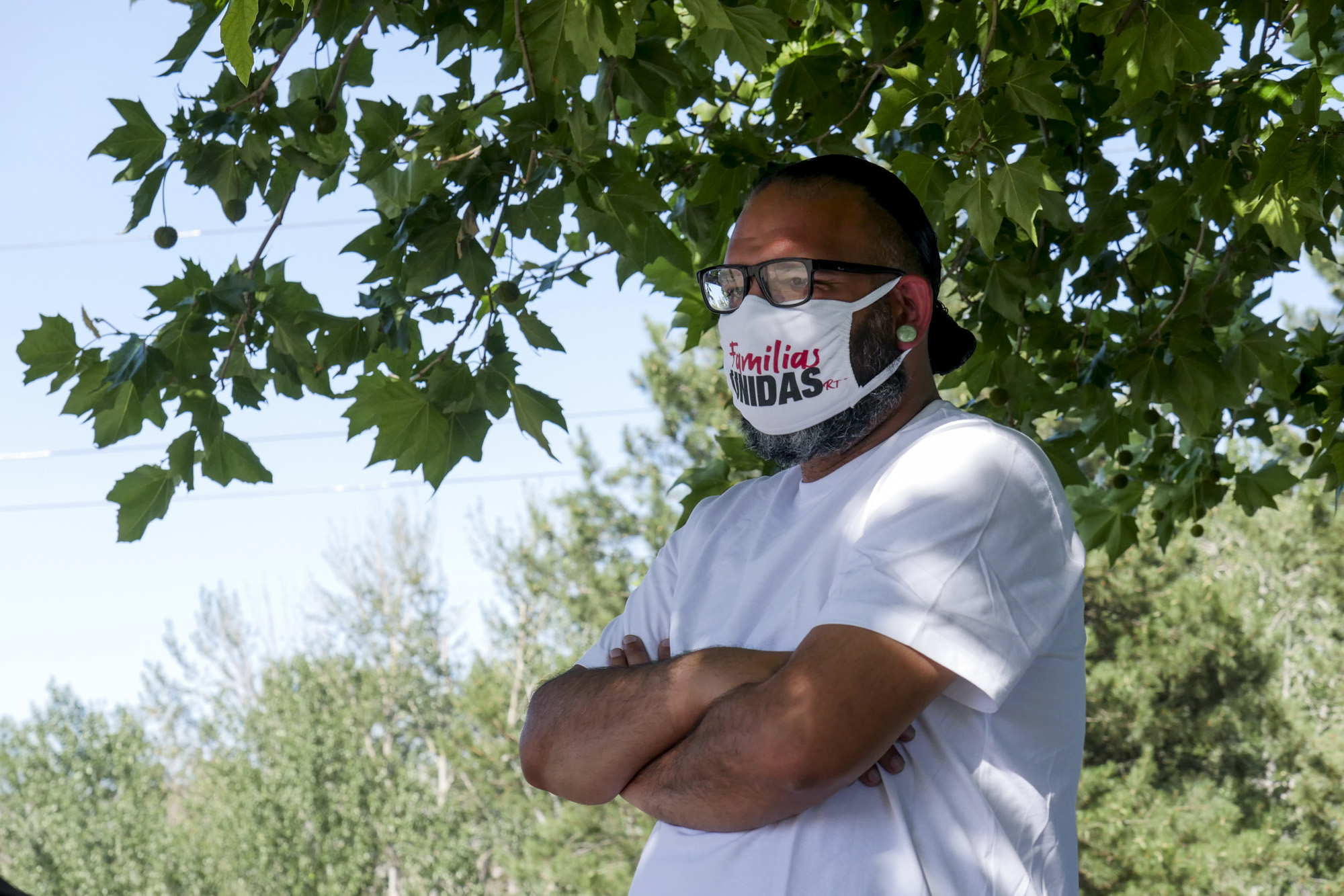 Man stands with mask on