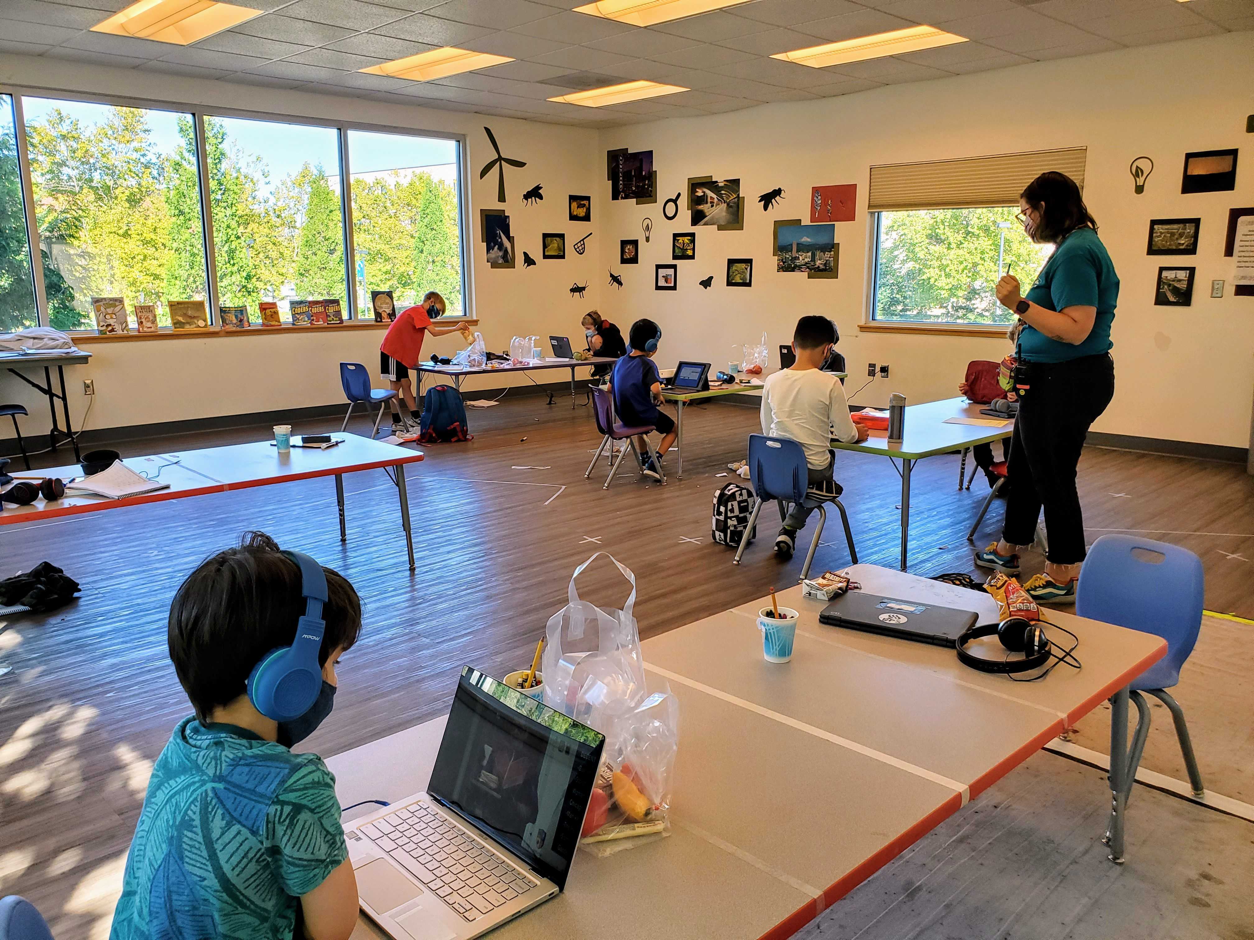 kids in a classroom set up in a museum