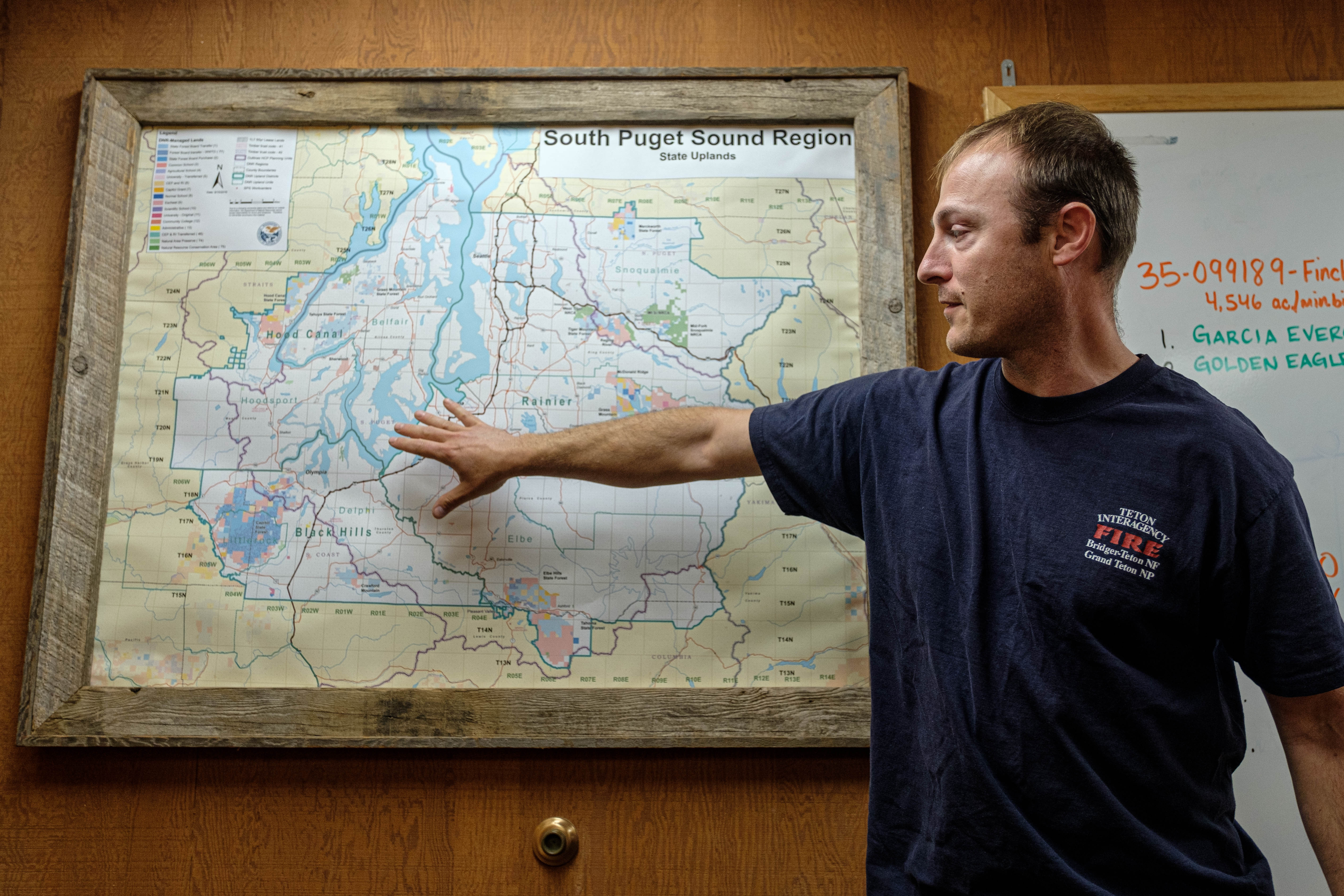 Daniel Donato points to a map