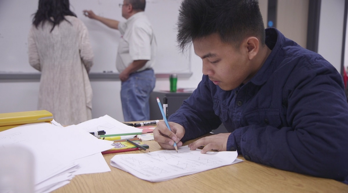 Joshua Villanueva arrives hours earlier than most of his peers for math tutoring. He is looking forward to graduation from Seattle World School next year. 