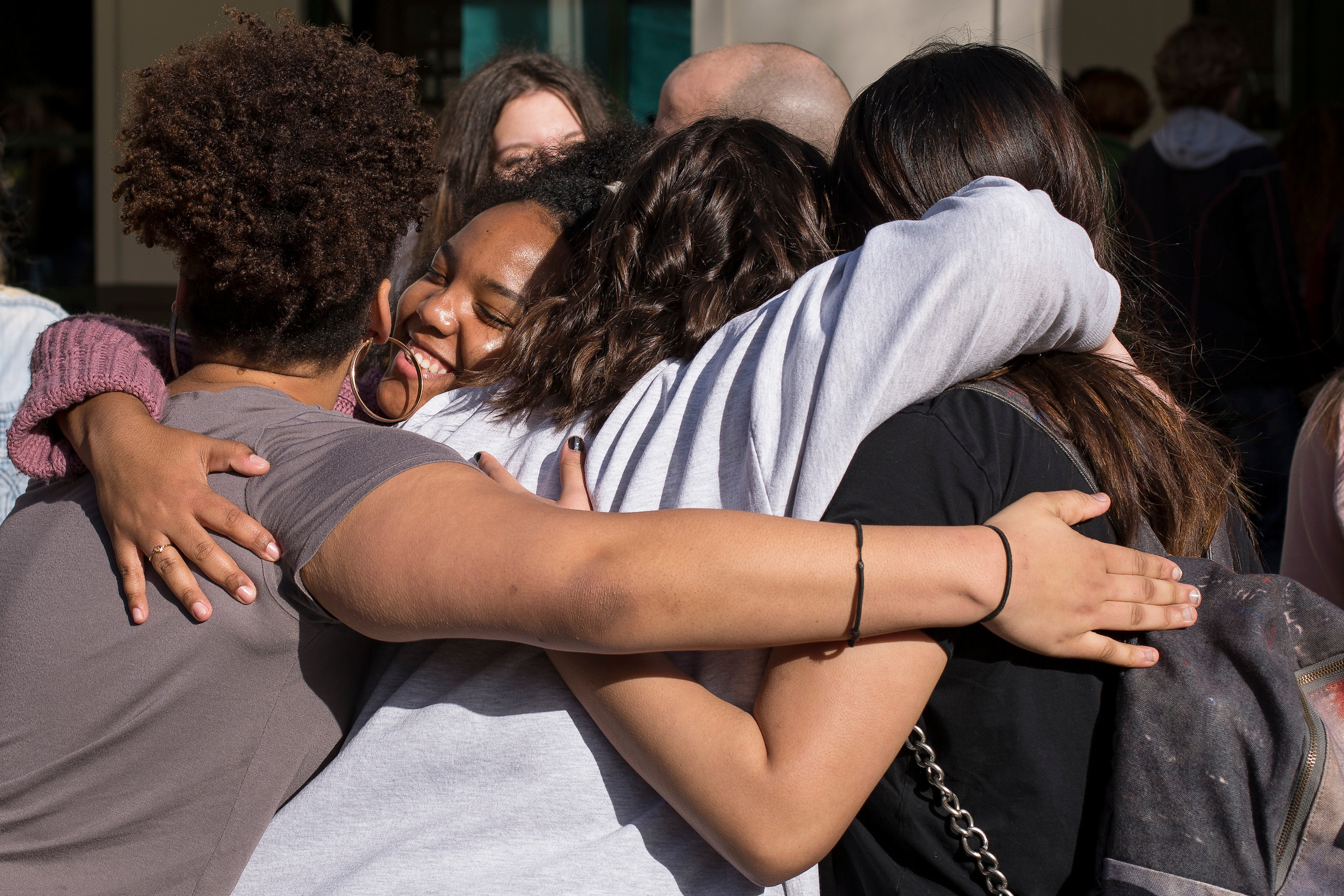 Cultural Awareness Club members at Tumwater High School celebrate after a walkout and rally they organized as part of a protests by students nationwide Wednesday, which were sparked by a school shooting in Parkland, Fla.