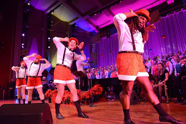 men dancing in santa shorts