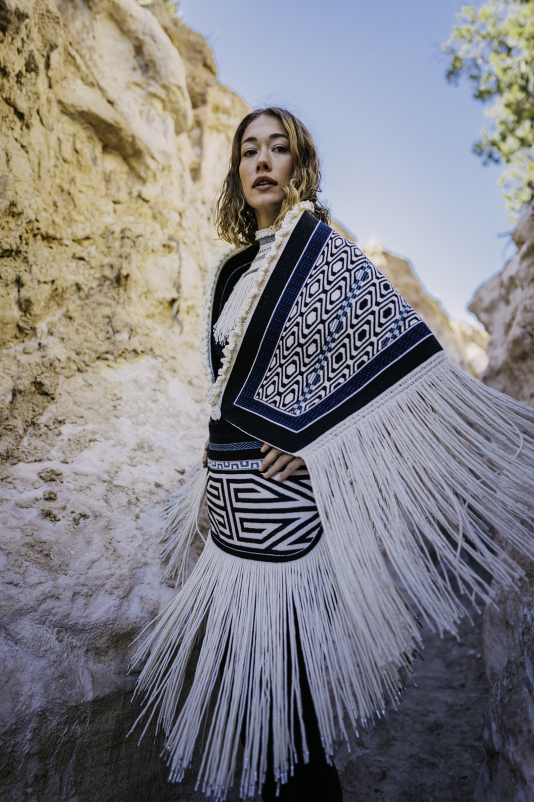 a woman models woven garments