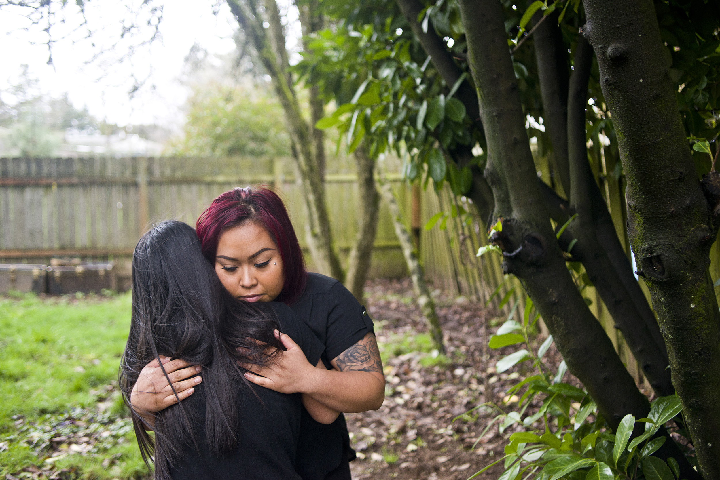 Sun Khliu is surrounded by family members in a photograph displayed at the home of his daughter, Bopha Khliu, in Portland, Ore. on Friday, February 16, 2018. Sun Khliu is currently being held at the Northwest Detention Center in Tacoma and is facing potential deportation to Cambodia. (Samuel Wilson for Crosscut)