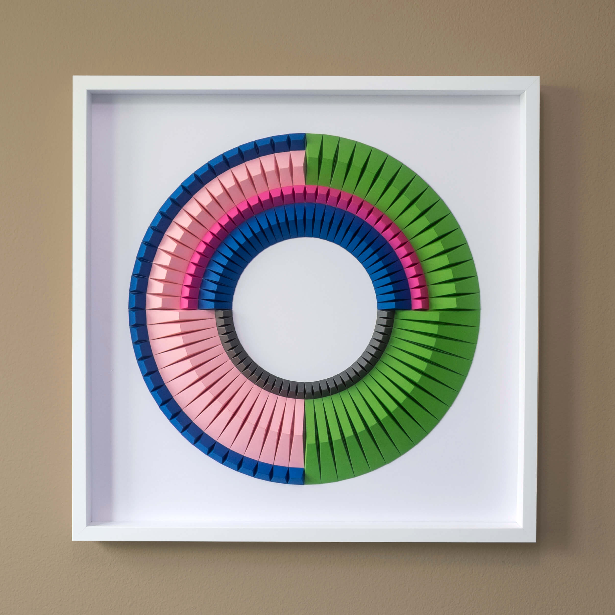 a circular artwork made of colorful folded paper