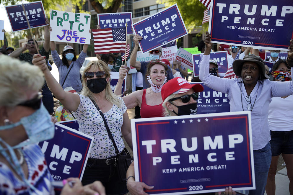 Trump supporters with signs