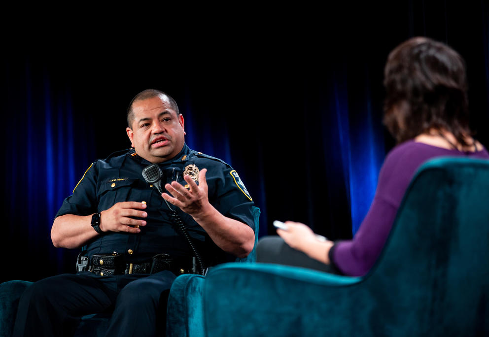 Seattle Chief of Police Adrian Diaz on stage with host Mónica Guzmán