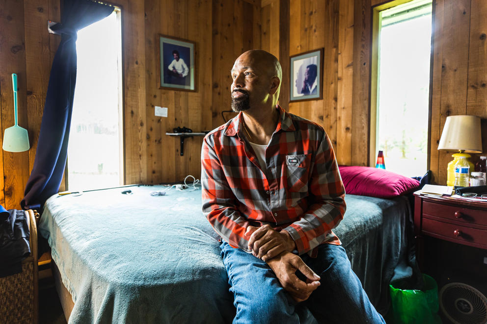 Nathaniel Sanders sitting on a bed