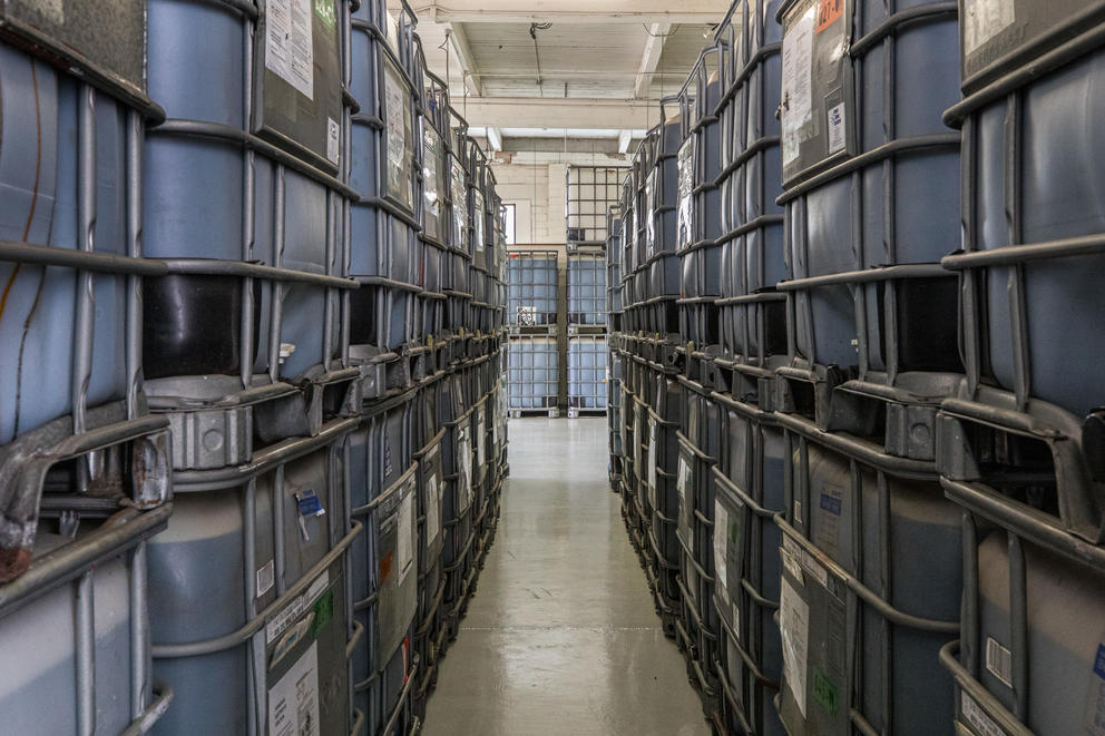 A row of containers on shelves