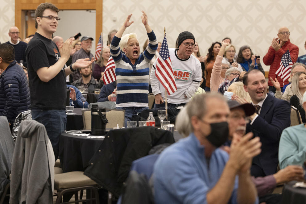 A group of people cheer