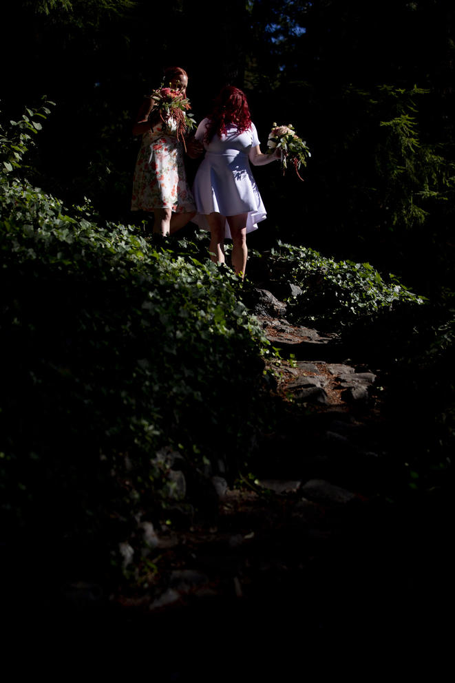 Jessica and Maia walk down their cobblestone path