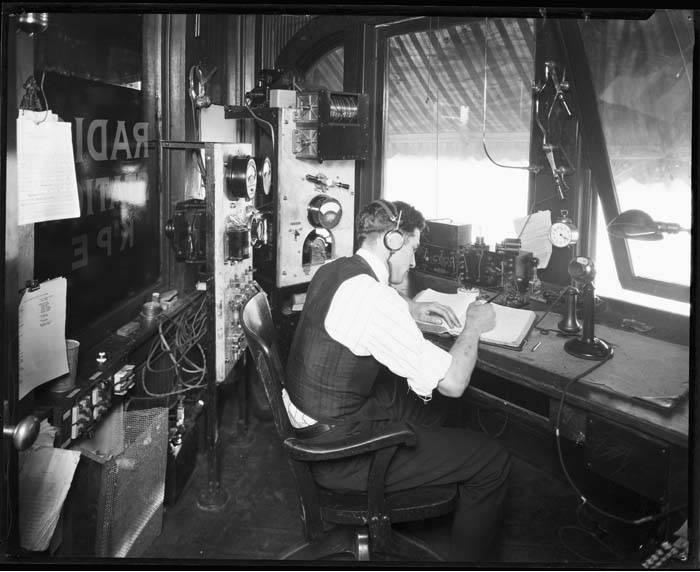 Man on radio, black and white