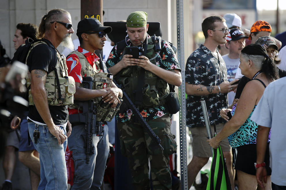 Armed men in aloha shirts