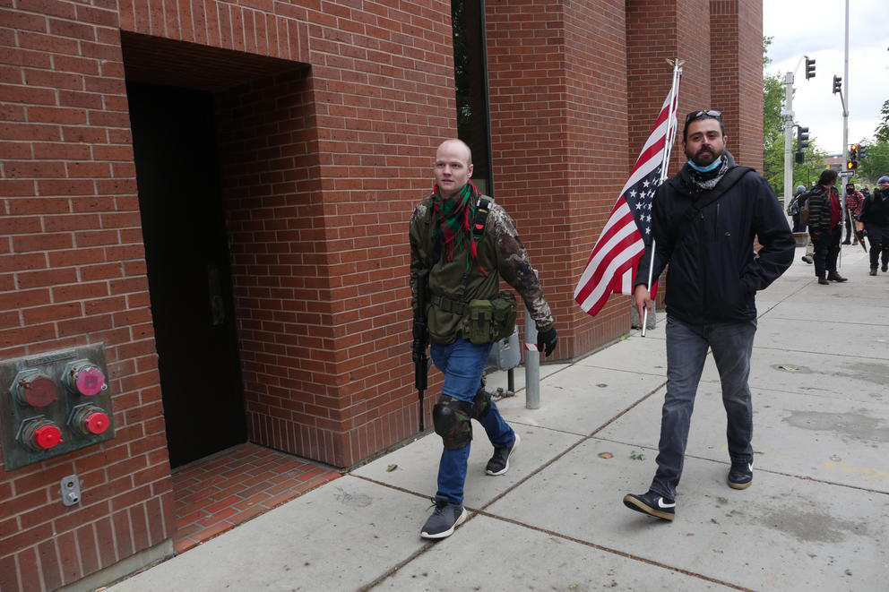 armed man walking 