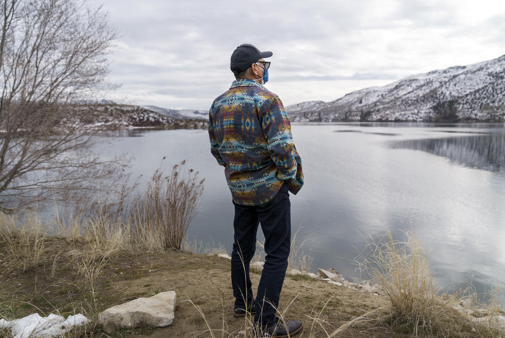 John Sirois stands in front of the water