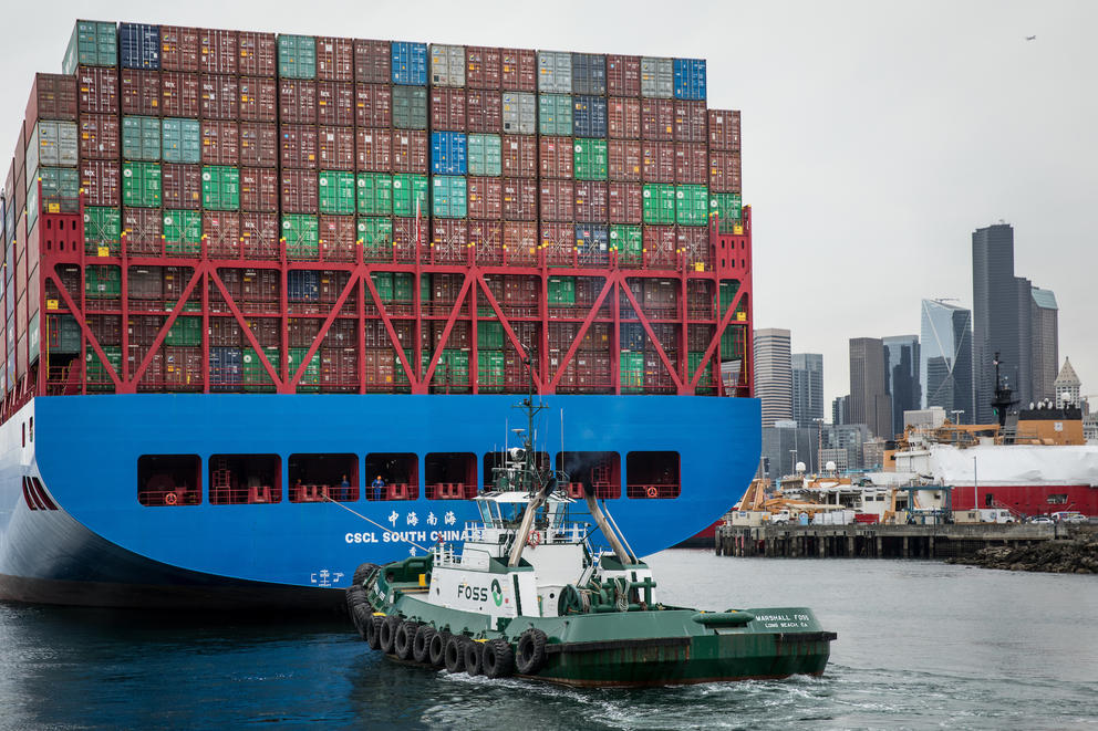 A Foss tug with a container ship