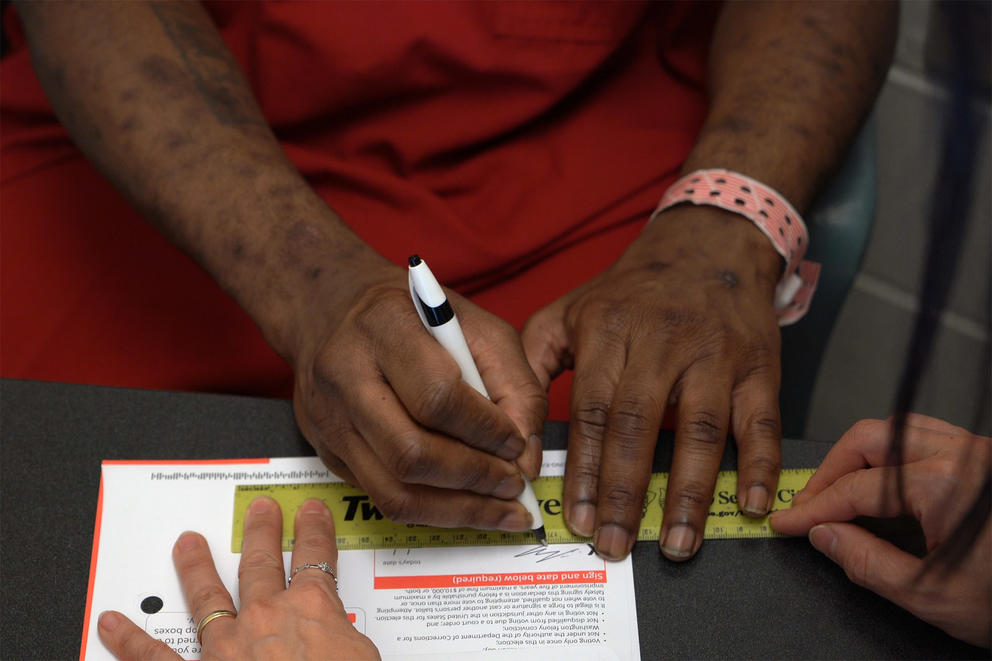 Jordan Landry as he signs his ballot for the November 2019 election 