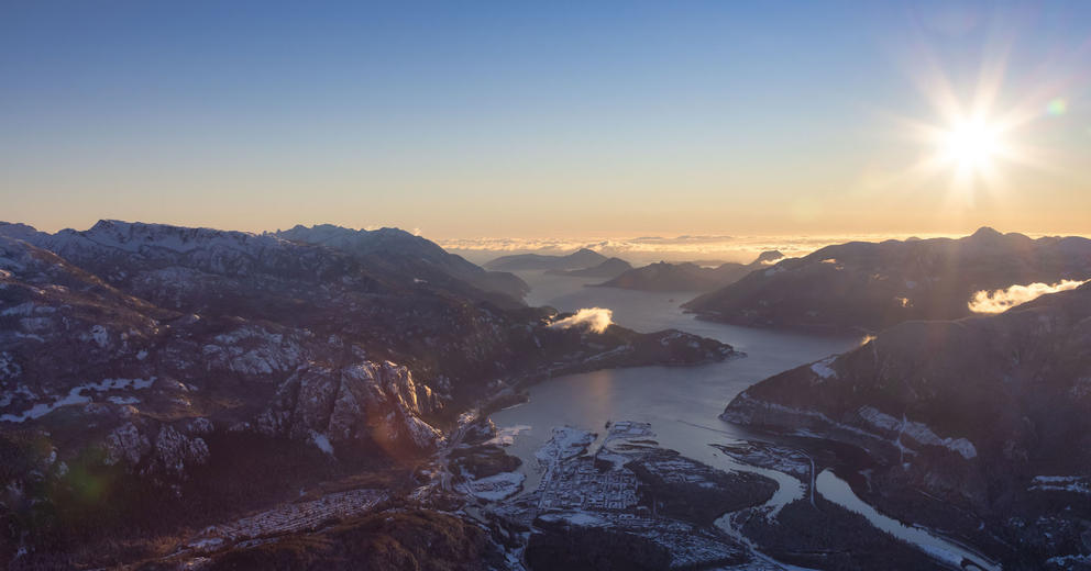 Aerial view of hills and the ocean at dawn