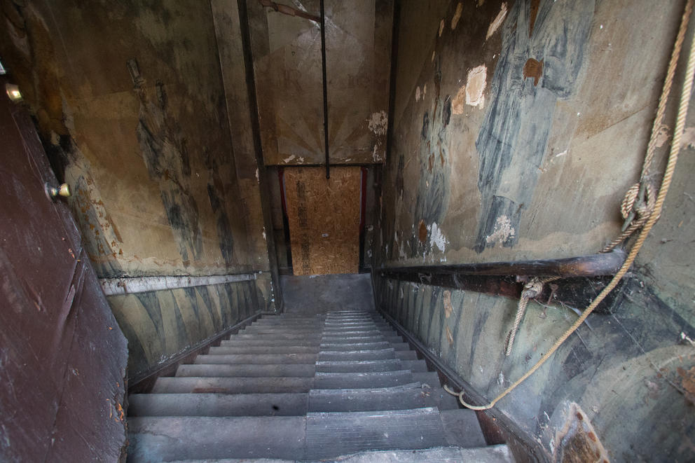 A view down the stairway of the Louisa Hotel in Seattle's Chinatown International District, where old murals line the walls from what used to be a 1920s era jazz club. 