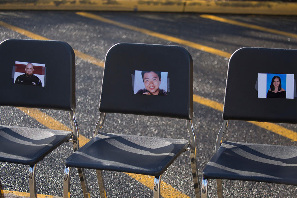  Pictures of victims of the school shooting in Parkland, Florida, are seen during a walkout and rally at Tumwater High School in Tumwater, Washington on March 14, 2018.