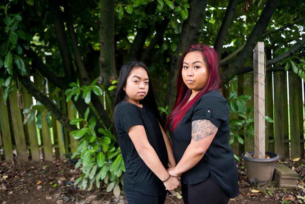 Bopha Khliu, right, poses for a portrait with her daughter, Angeliyah Khliu, 13, at their home in Portland, Ore.