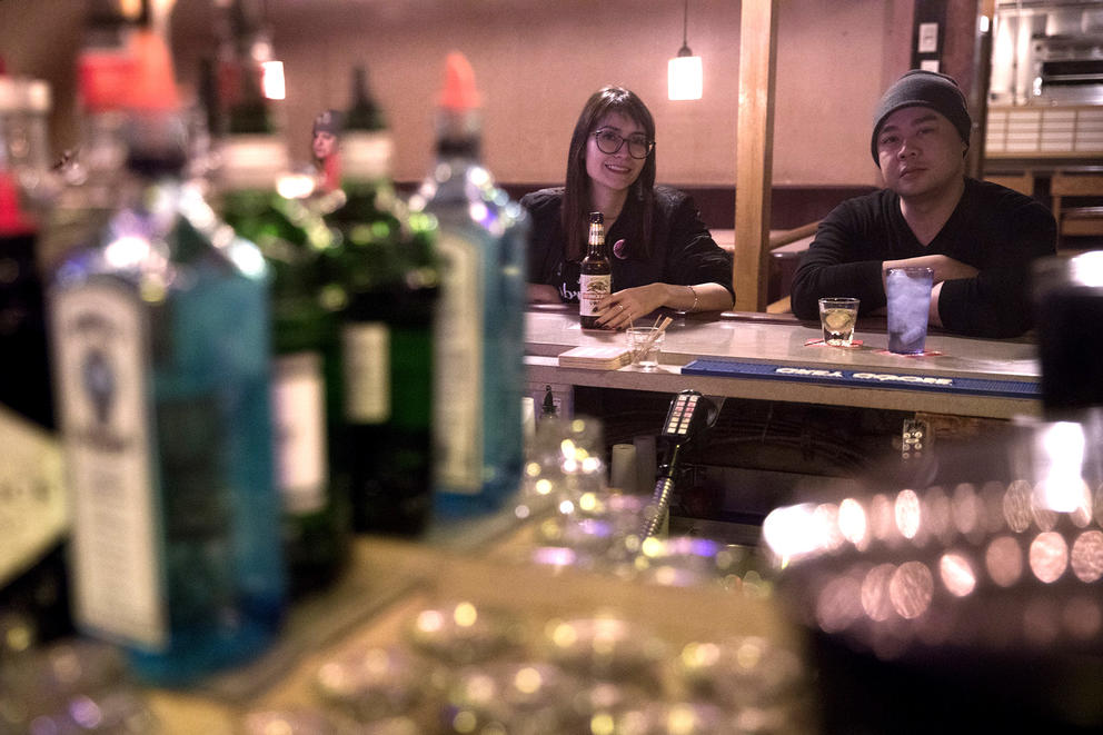 Cynthia Brothers and Martin Tran sitting at the bar of Bush Garden