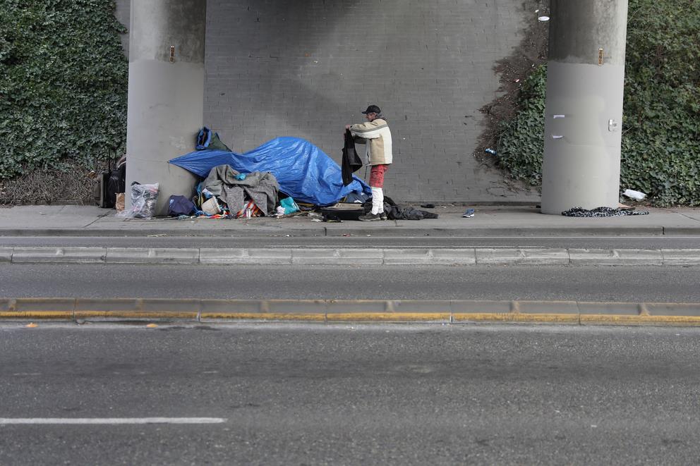 A man outside the site of a small encampment in Seattle