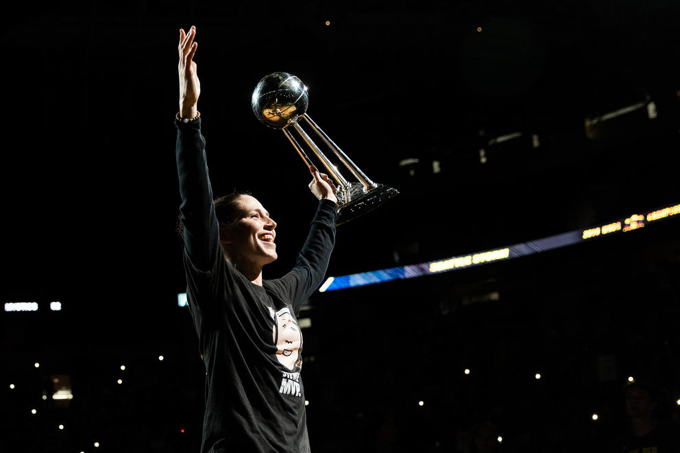 Sue Bird holds the WNBA championship trophy