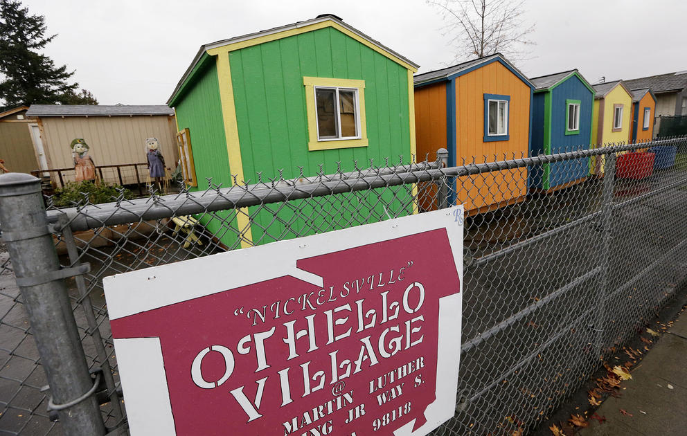 a row of colorful tiny home homeless shelters in seattle